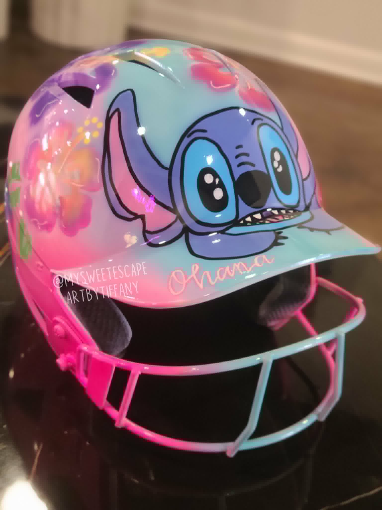 Custom-painted softball helmet featuring Stitch with hot pink accents