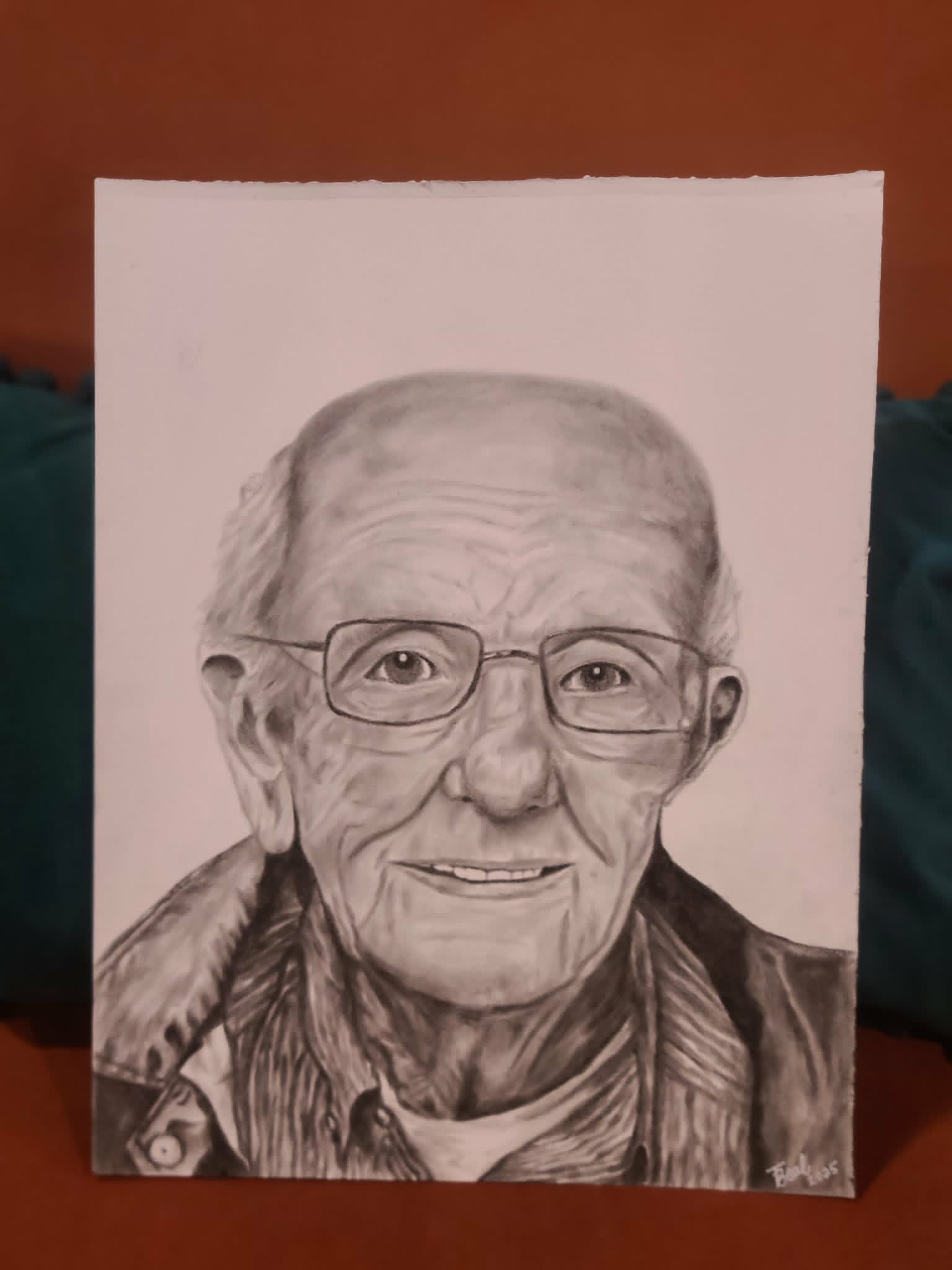 Detailed charcoal portrait of an older man with glasses