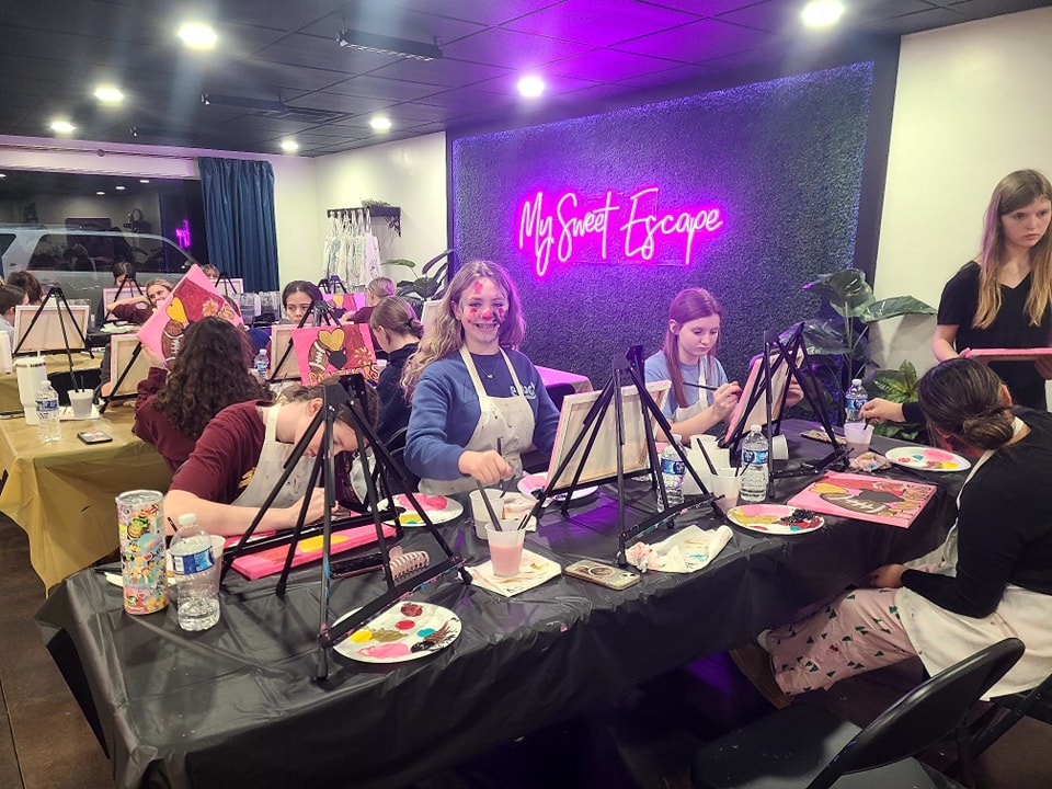 Long studio table set up for a private paint party event